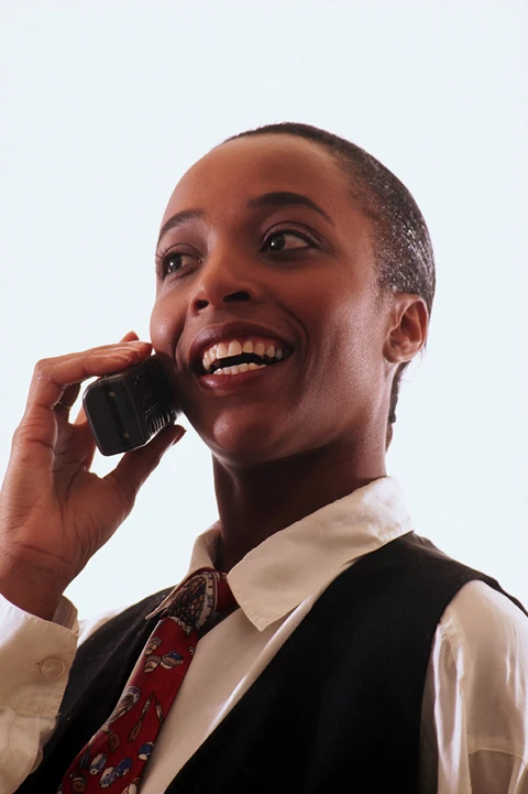A professional taking part in a telephone conversation